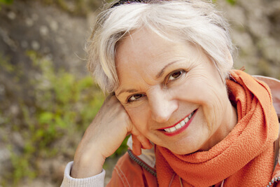 Senior woman smiling after cataract surgery