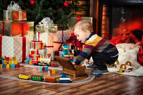 toddler playing with toys on christmas