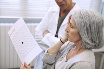 Woman taking the Amsler test