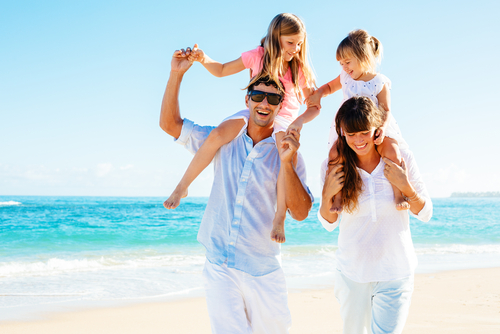 Young family relaxing on the beach