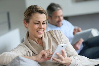 Woman reading the EMG Newsletter