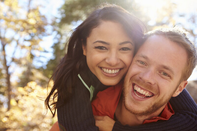 Young couple smiling after LASIK