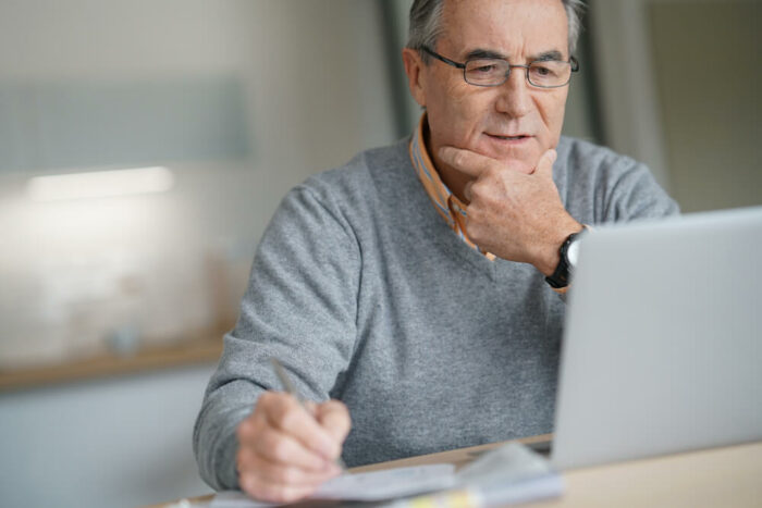 senior male on his laptop