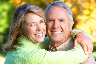 Senior couple smiling after diabetic retinopathy treatment